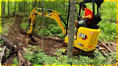 mini dozer vs mini excavator for building trails|mini excavator trail building.